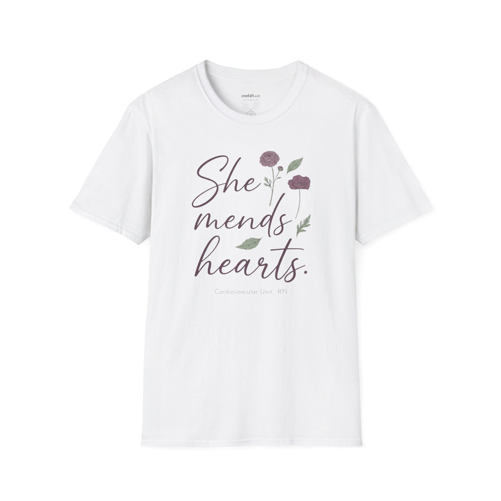 White t-shirt with 'She mends hearts' text and floral design on a white background